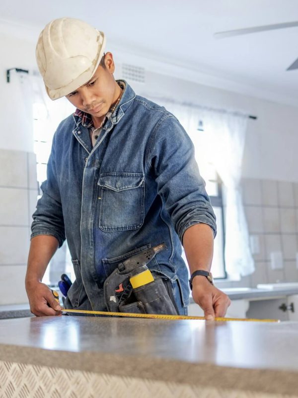 construction measurement and handyman doing home repair renovation and building a counter servic